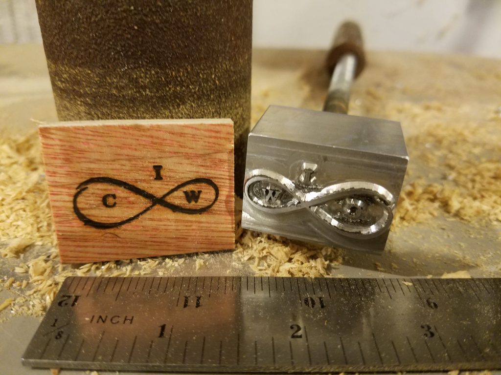 ICM Infinity Logo custom branding iron made in the USA. A custom wood burning stamp 1inch in length.