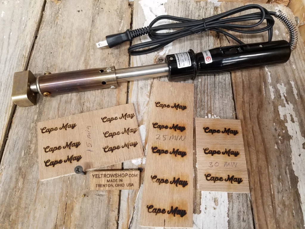 An electrically heated branding iron and the results achieved after 15, 25, and 30 minutes.